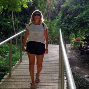 Micheline walking in the tropics